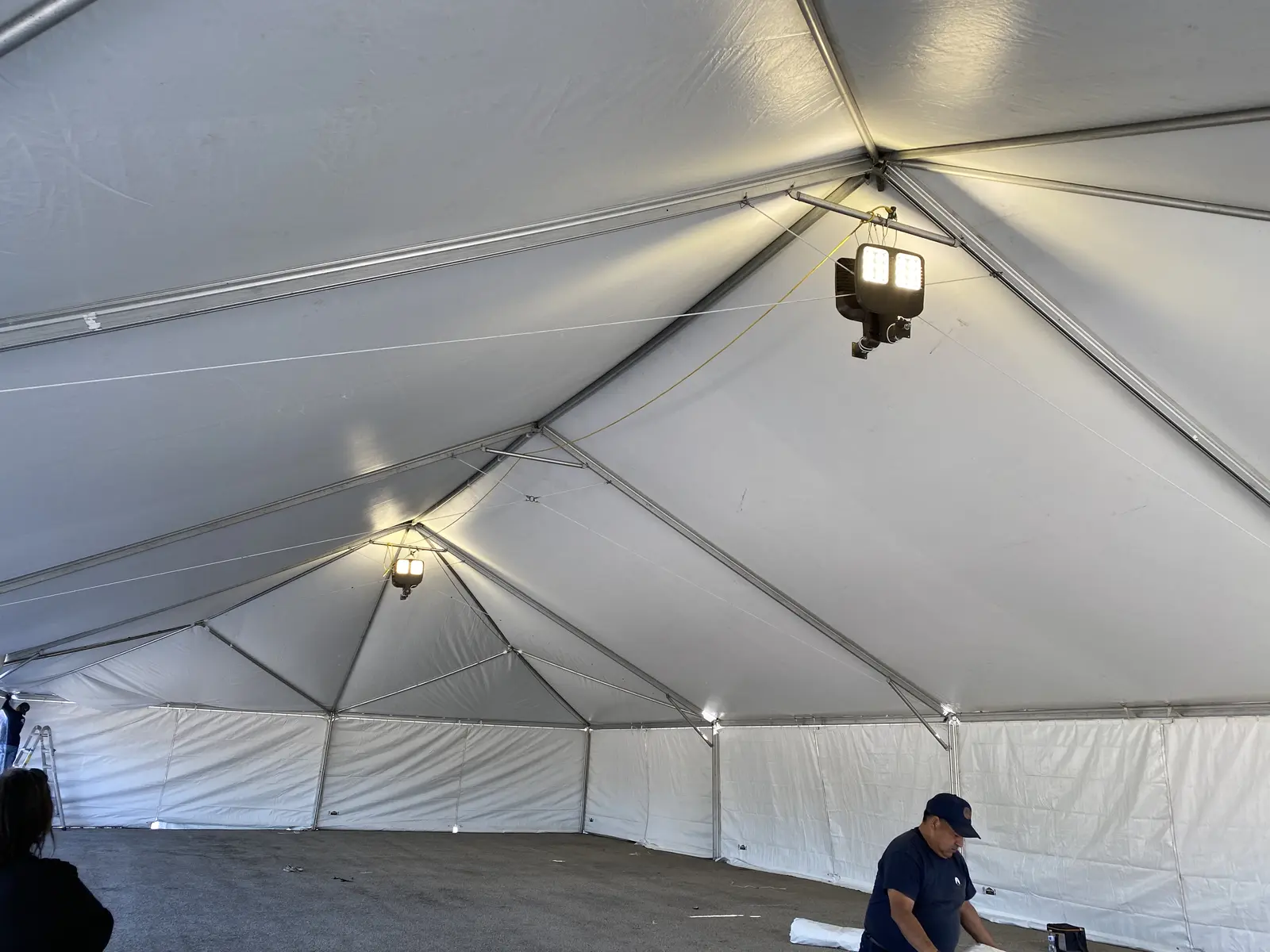 Temporary lighting inside a large event tent