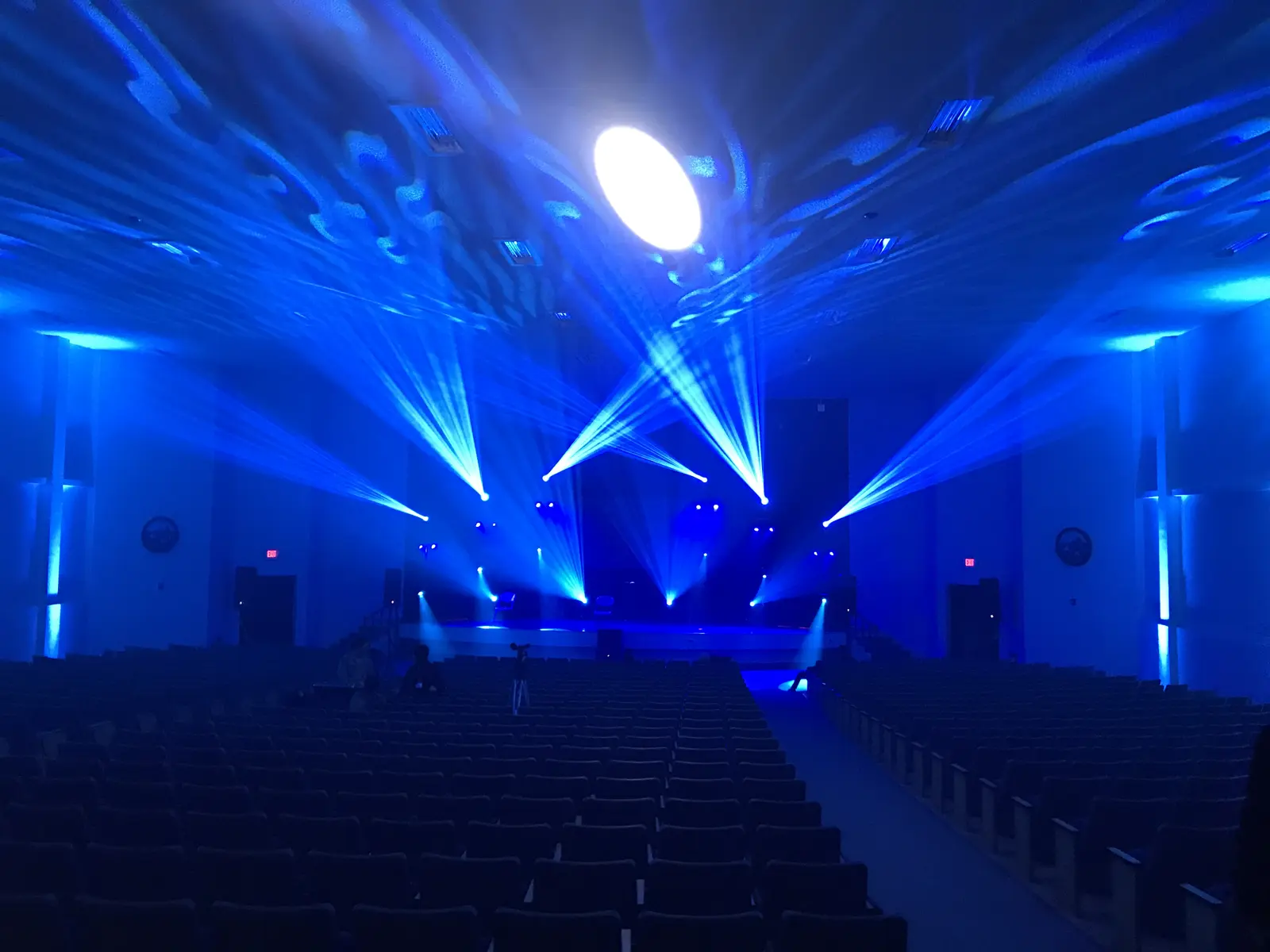 Blue stage lighting in an auditorium