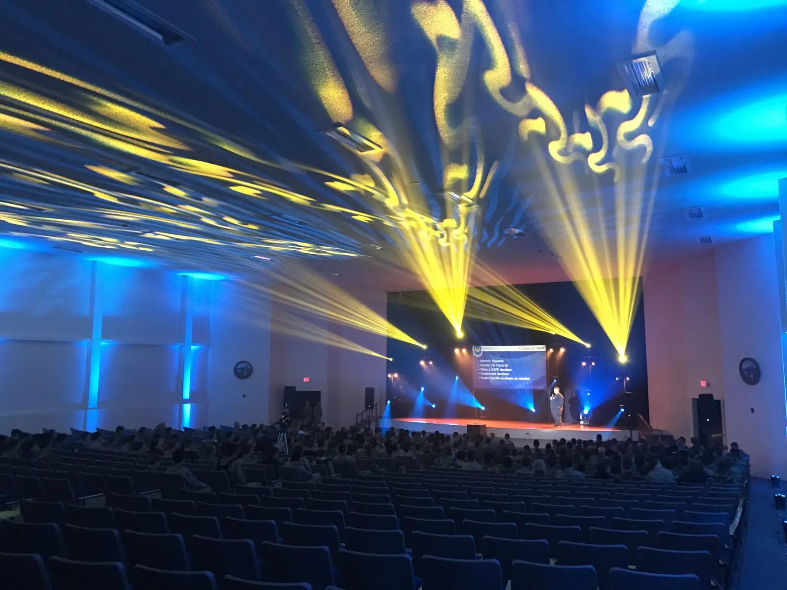 Gold event lighting across an auditorium