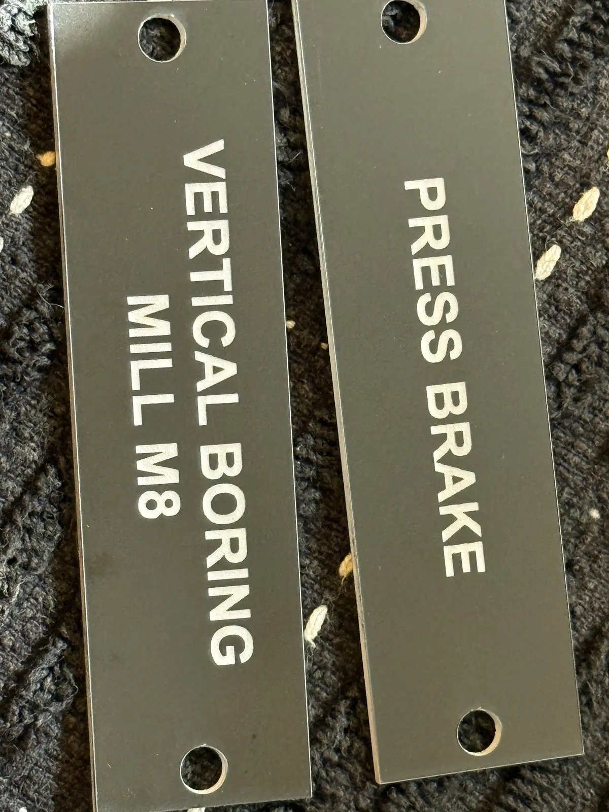 Equipment labels engraved in metal