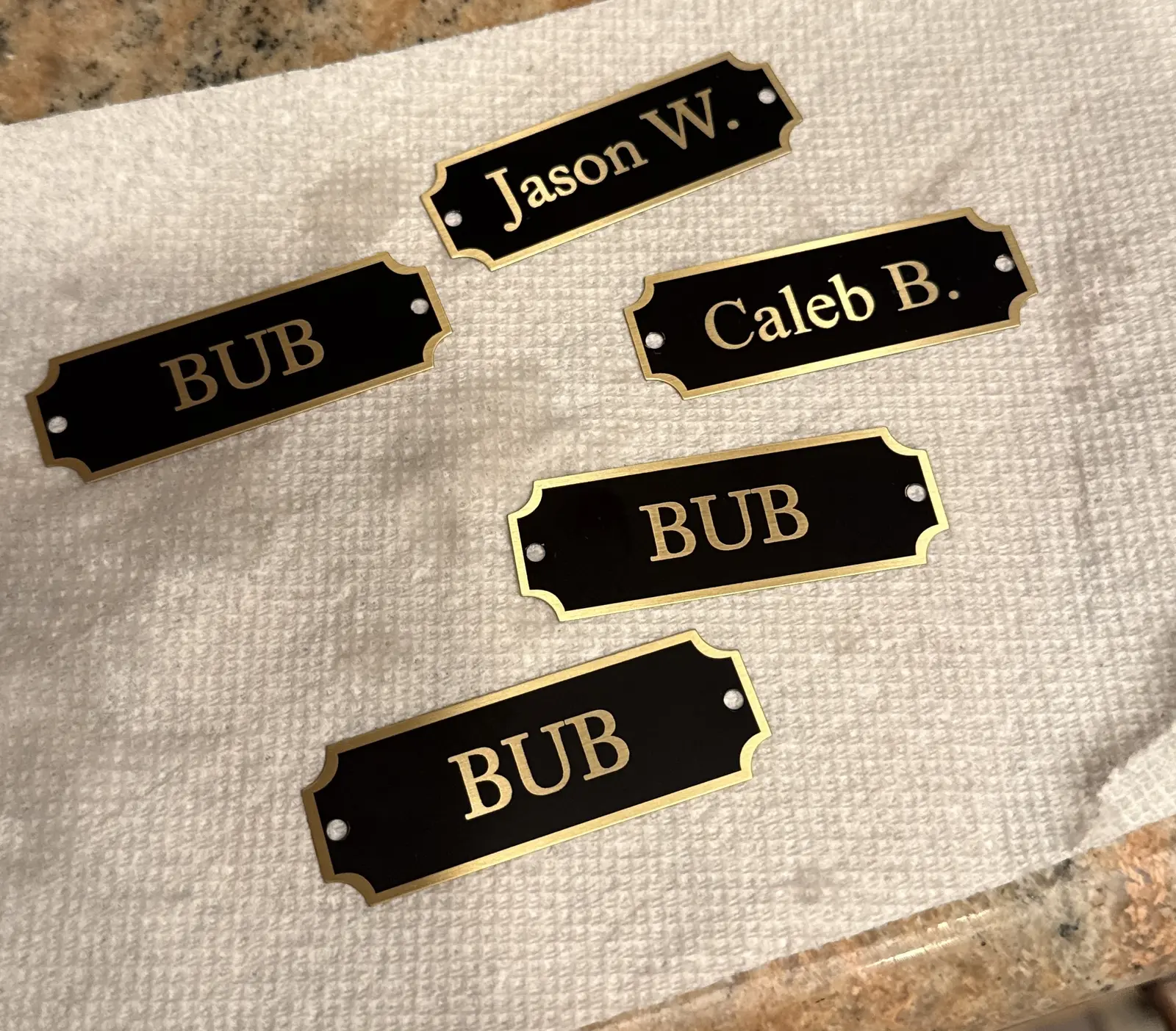 Black and gold personalized name tags