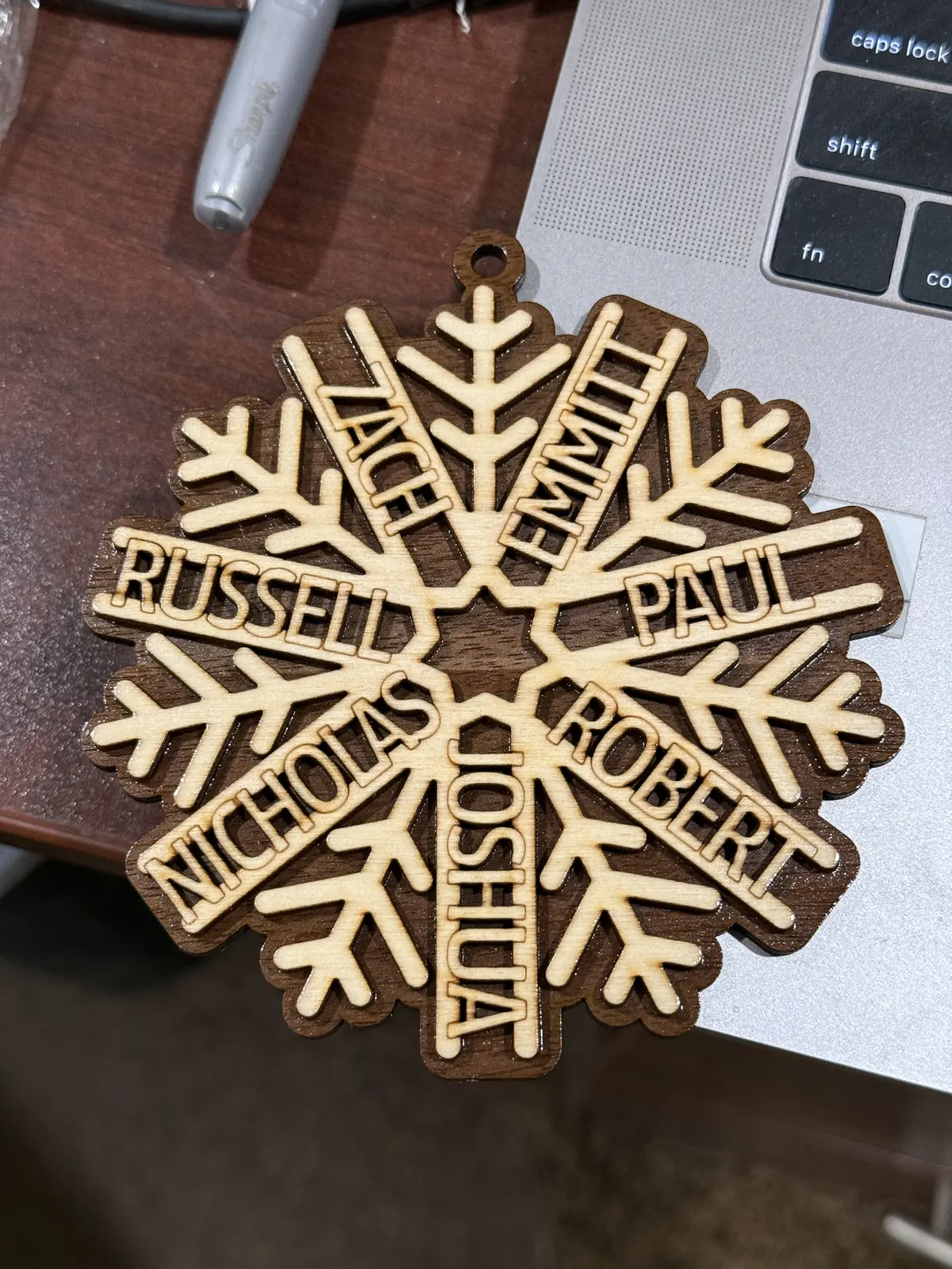 Detailed wooden snowflake ornament