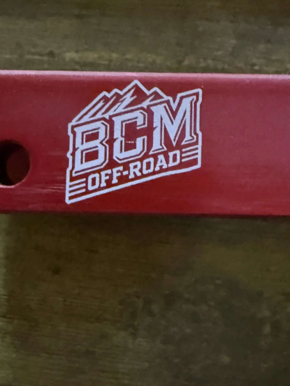 Vehicle part engraved with a logo