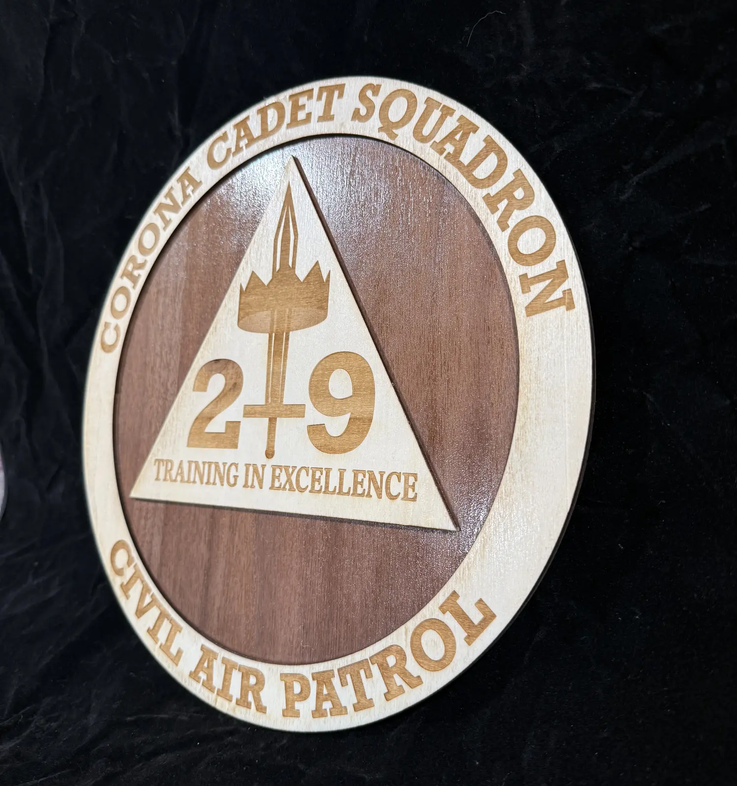 Civil Air Patrol emblem engraved in wood